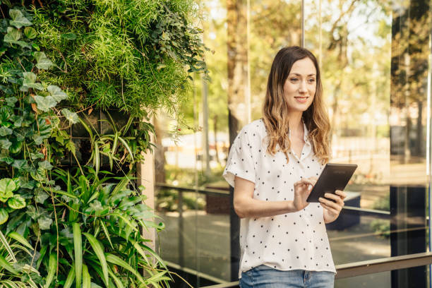 istock Woman with mobile phone smiling 1435025450