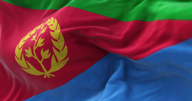 Close-up view of the Eritrea national flag waving in the wind. Close-up view of the Eritrea national flag waving in the wind. The State of Eritrea is a State located in the northern part of the Horn of Africa. Fabric textured background. Selective focus eritrea stock pictures, royalty-free photos & images