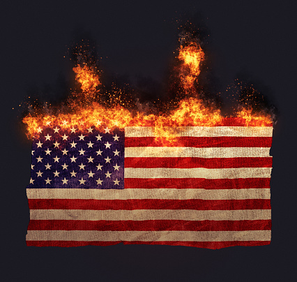 Flag of the United States going up in flames.