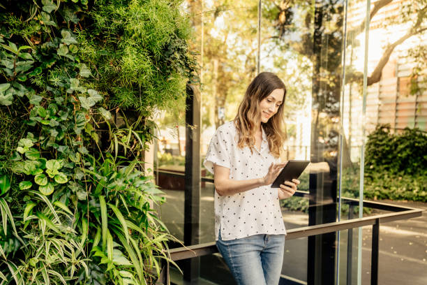 Woman with mobile phone smiling