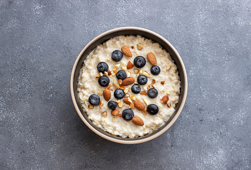 Oatmeal with blueberries, almonds and honey. Healthy food. Vegetarian food.