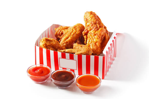 istock Fried chicken in a red and white carry-out box with sauce 1435027671