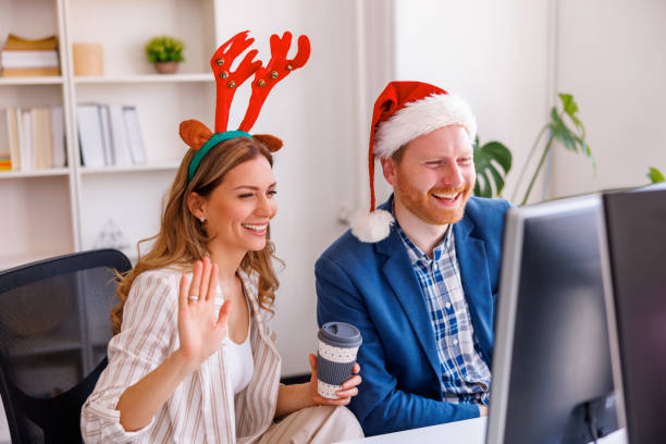 istock Business people having online meeting while working at the office during Christmas 1435030572