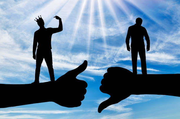 istock Selfishness and ego. An arrogant selfish man with a crown on his head, considering himself better than the other person. 1435031810