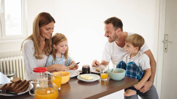 istock Parents with their kids in dining room having breakfast together 1435033880