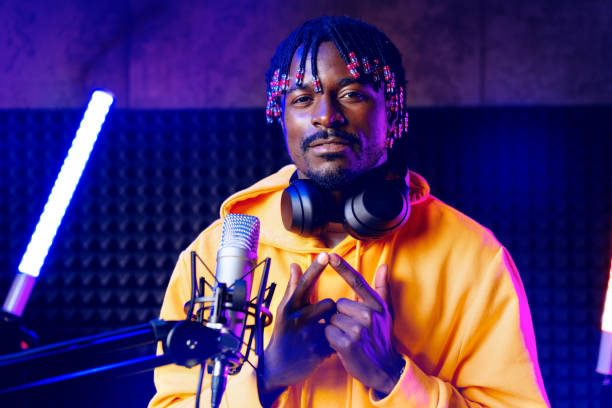 istock Young African performer recording his new track in recording studio 1435034134