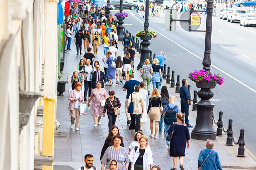 Crowd of people walking around the city in summer July 7, 2022 St. Petersburg Russia