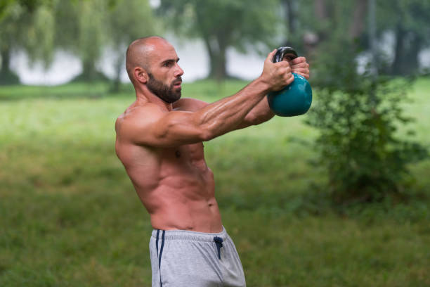 istock Fitness Kettlebell Swing Exercise Man Workout Outdoors 1435035794