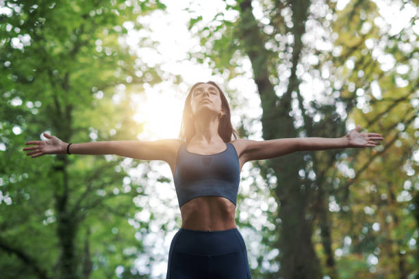 istock Woman exercising in the forest 1435035796
