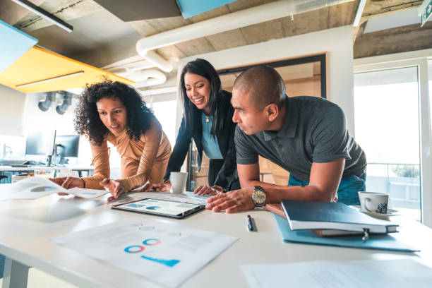 istock Good Looking Hispanic Employees Working In A Modern Office 1435036846