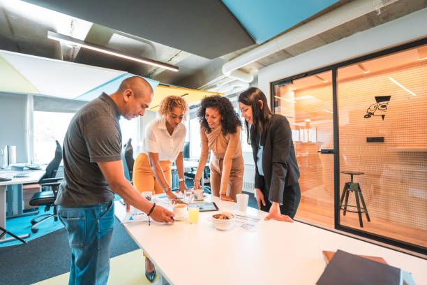 istock Good Looking Hispanic Employees Working In A Modern Office 1435036861