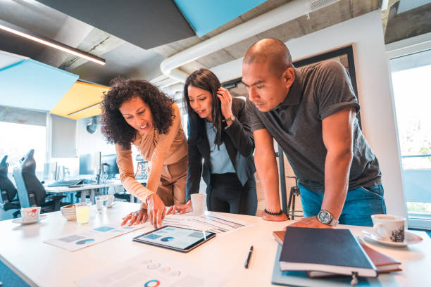 istock Good Looking Hispanic Employees Working In A Modern Office 1435036869