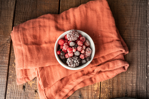 Frozen berry fruits in a bowl
