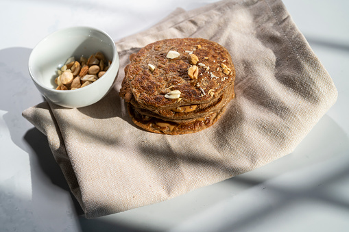 Vegan American pancakes with peanut butter, banana and agave syrup