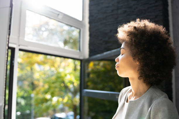 istock Fresh Air At Desk In Office African American Relaxing 1435042663
