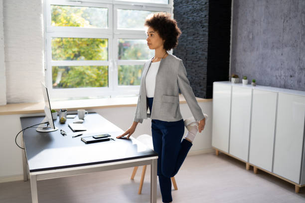 istock Yoga Workout In Office Behind Business Computer 1435042693