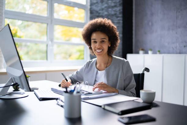 istock Disabled Accountant In Wheelchair Working 1435042851