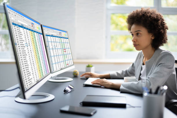 istock Medical Coding Spreadsheet On PC. African Woman 1435042857