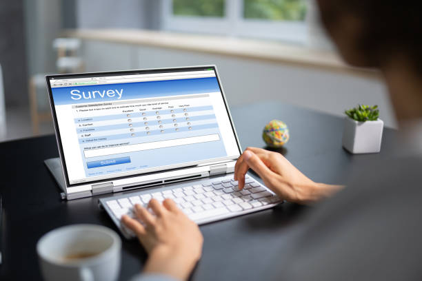 istock Woman Looking At Online Computer Survey 1435043316