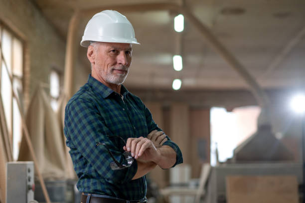 istock Mature man standing in a workshop and looking confident 1435046633