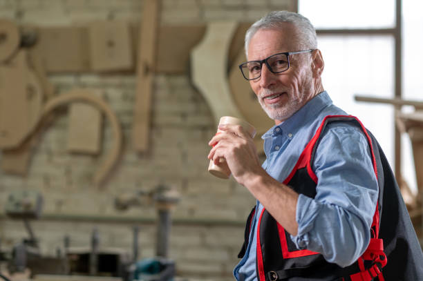 istock Confident mature man with a paper cup with coffee 1435046677