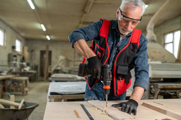 istock Craft person drlling wood in the workshop 1435046992
