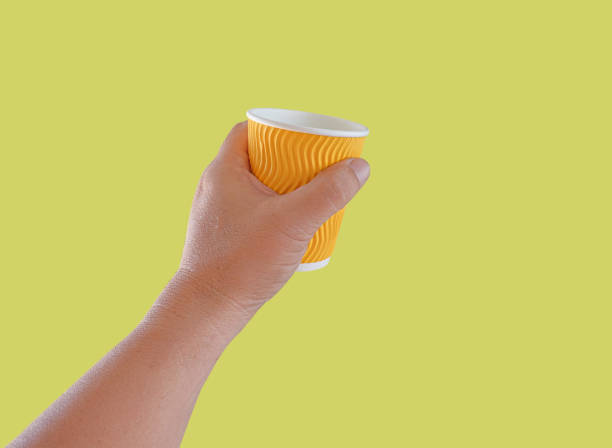 istock Hand hold a hot drink in to go paper cup. 1435048143