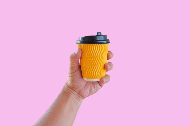 istock Hand hold a hot drink in to go paper cup. 1435048144