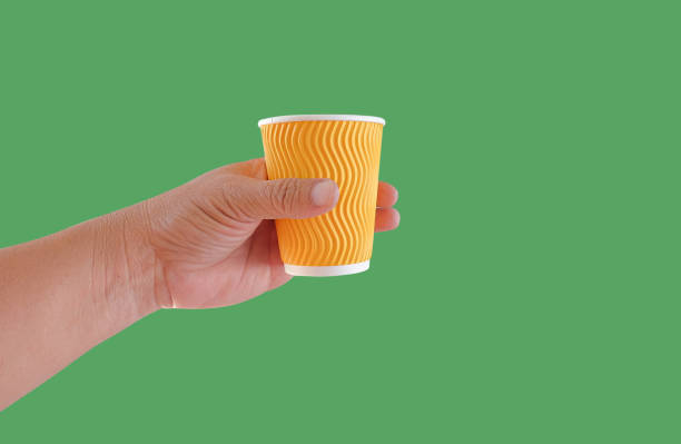 istock Hand hold a hot drink in to go paper cup. 1435048163
