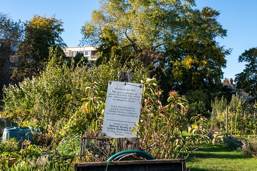 Newcastle upon Tyne, United Kingdom – October 14, 2022: A sign detailing the Allotment Act 1972 at the entrance to a UK allotment site