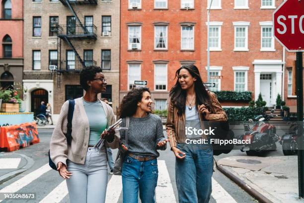 Three Friends Are Walking Together In The Street Gay St New York City Usa Stock Photo - Download Image Now