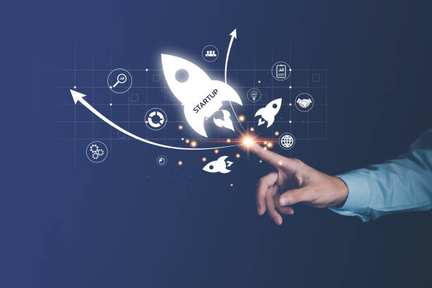 istock Startup concept. Businessman touch rocket launch icon and network connection on hologram virtual interface. Fast business success. 1435049031