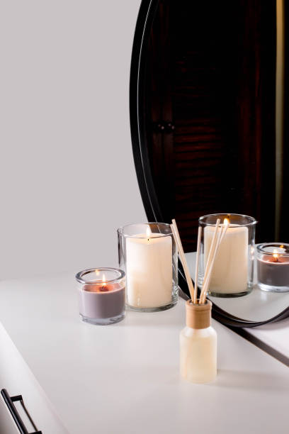 istock Aroma diffuser and scented candles that create coziness in the house. Romantic atmosphere. Details in the house that create coziness 1435050092