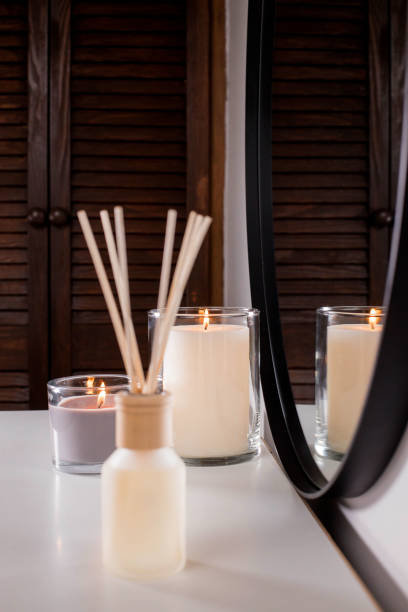 istock Aroma diffuser and scented candles that create coziness in the house. Romantic atmosphere. Details in the house that create coziness 1435050102