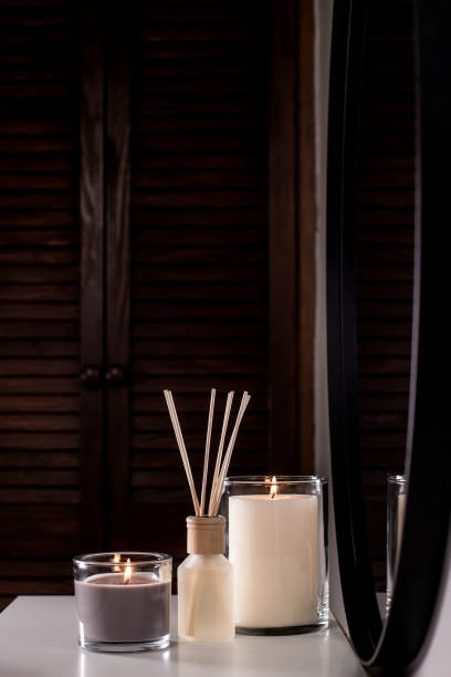 istock Aroma diffuser and scented candles that create coziness in the house. Romantic atmosphere. Details in the house that create coziness 1435050179