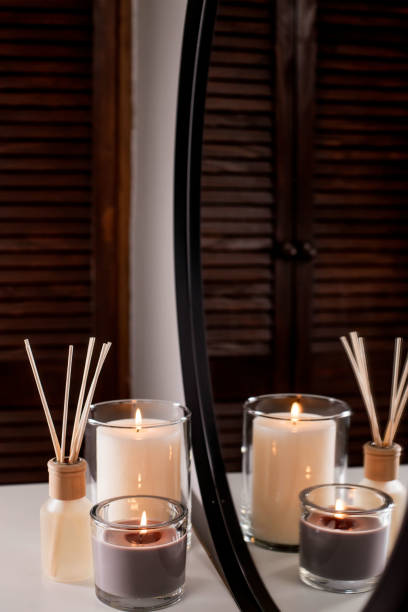 istock Aroma diffuser and scented candles that create coziness in the house. Romantic atmosphere. Details in the house that create coziness 1435050736