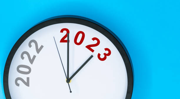 istock New year number 2022 and 2023 on clock 1435051415