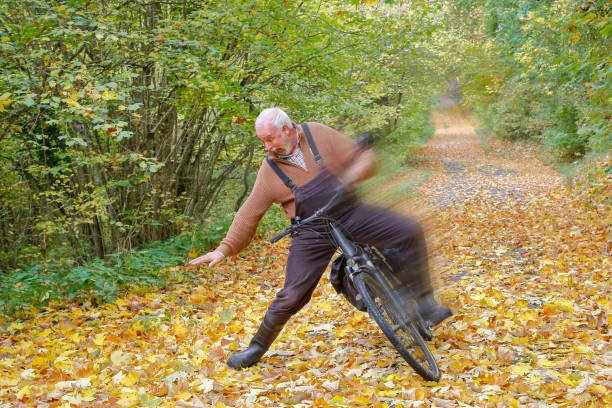 Autumn leaves risk of accidents for cyclists. stock photo