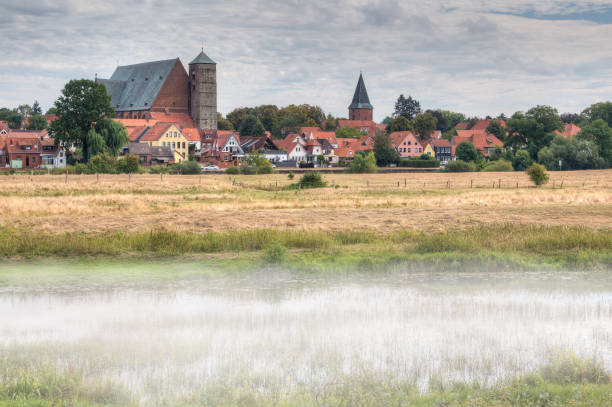 The old town of Verden in the morning mist. stock photo