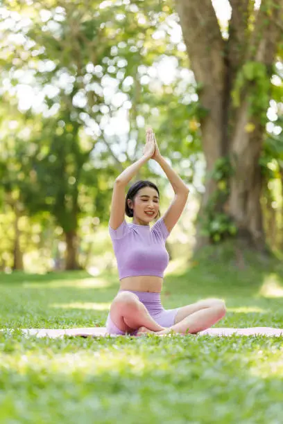 Pretty slim perfect body asian women wear sportswear to playing basic yoga compose.