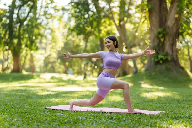 Pretty slim perfect body asian women wear sportswear to playing basic yoga compose.