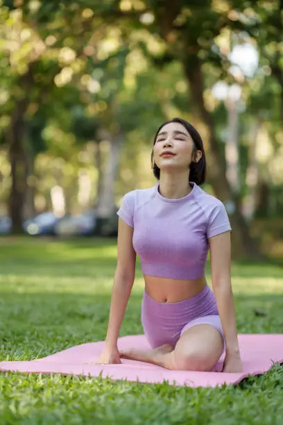 Pretty slim perfect body asian women wear sportswear to playing basic yoga compose.