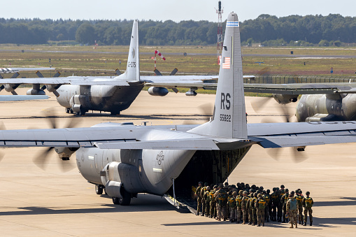 Paratroopers entering a US Air Force C-130 Hercules transport plane on Eindhoven airbase. The Netherlands - September 20, 2019.