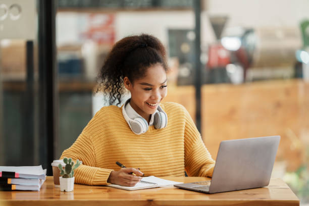 istock studentwoman working in a cafe 1435054381