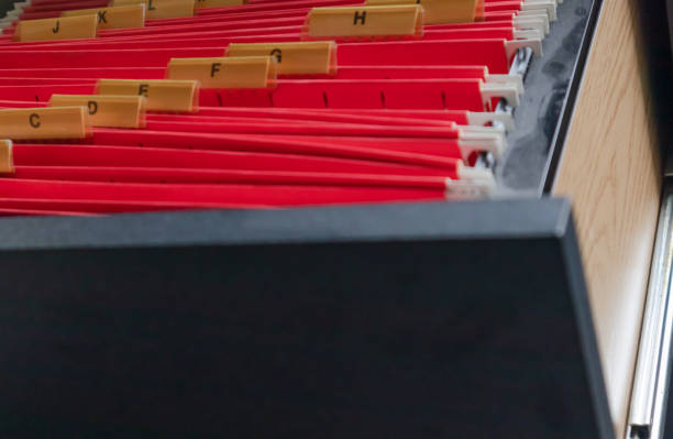 istock Red alphabetical hanging files in an open drawer 1435057247