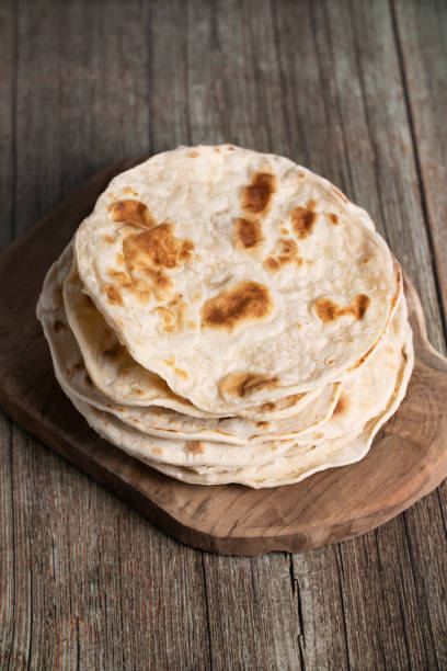 istock Indian chapati flatbread and cilantro on the wooden table 1435058793
