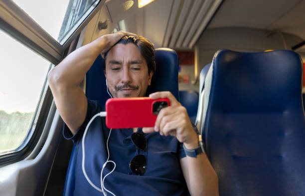 istock Man watching a soccer game on the train and looking worried 1435059459