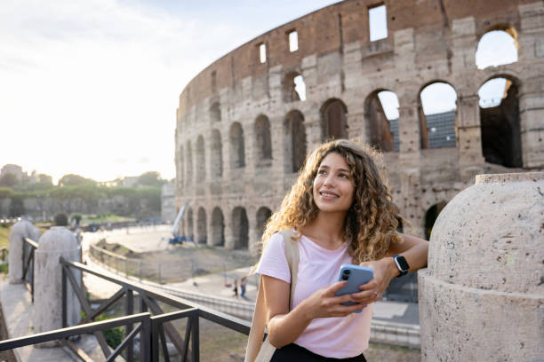 istock Happy traveler in Rome visiting the Coliseum 1435061387