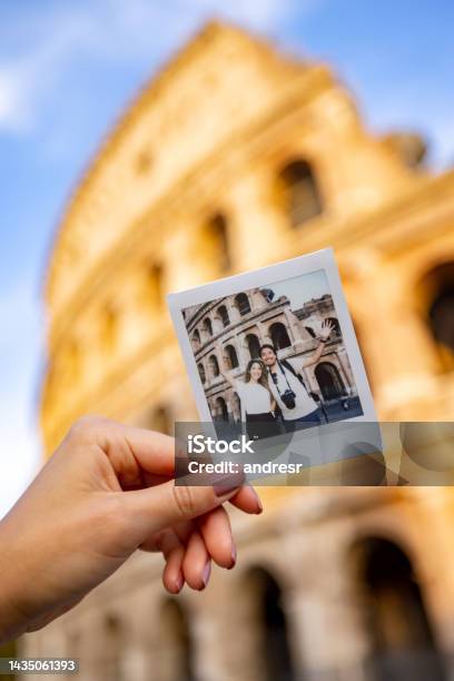 Tourists Taking A Photo At The Roman Coliseum With An Instant Camera Stock Photo - Download Image Now