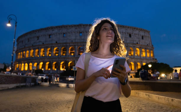 istock Tourist using a map app to find the Coliseum while traveling in Rome 1435061409